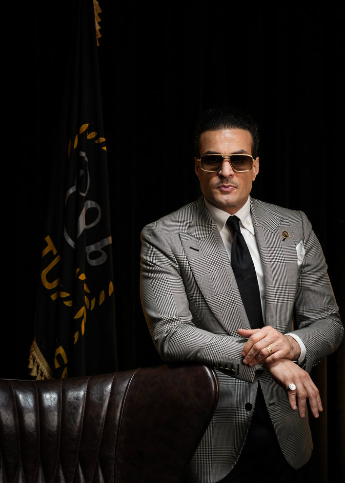 Mo Adass at Signature Bespoke reviewing fabrics during a bespoke tailoring consultation